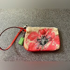 Coach wristlet with flower pattern